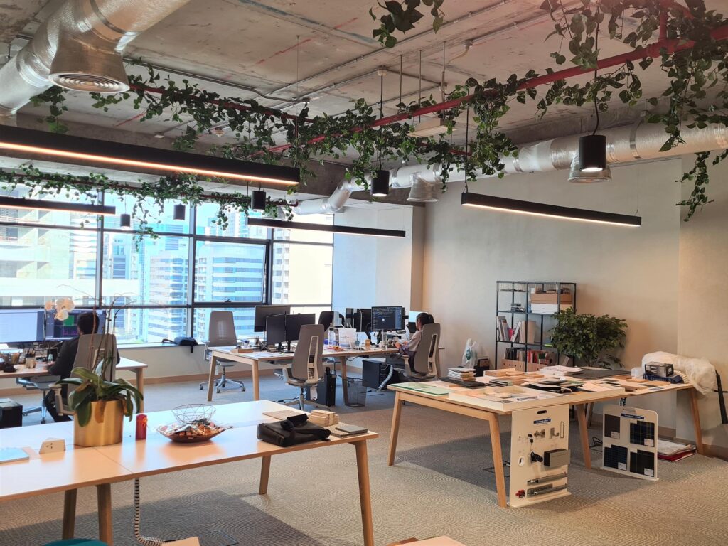 Office interior with green plants by Cultivate UAE